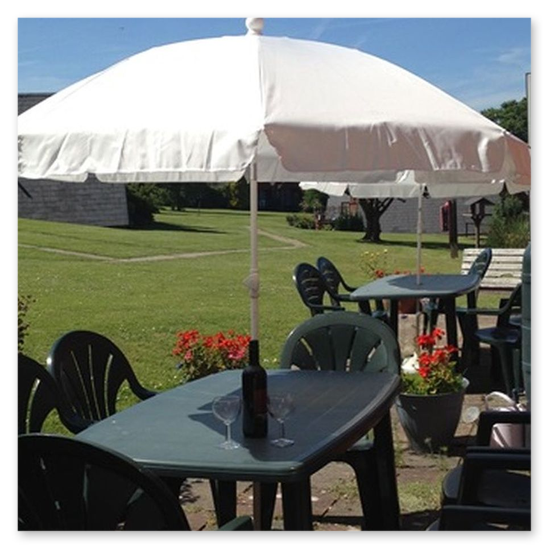 Dining table with six seats and parasol provided