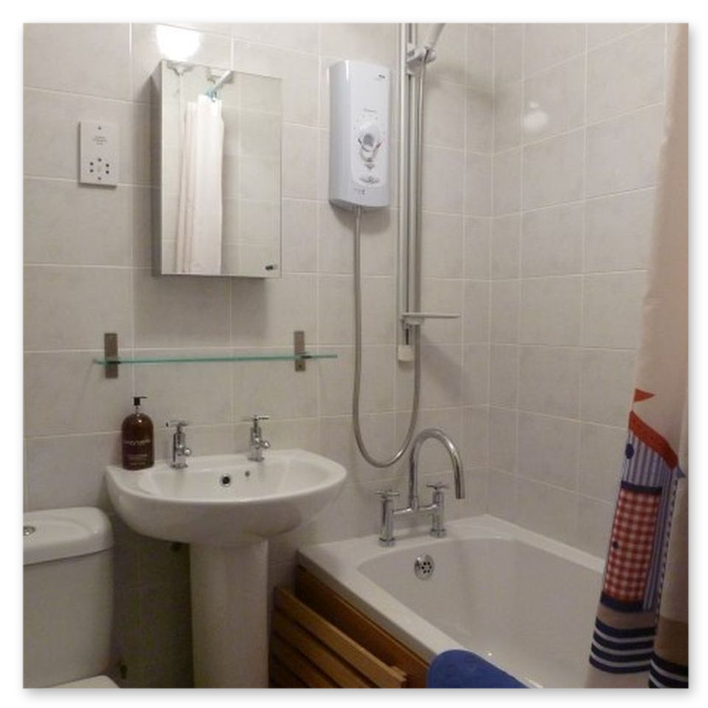 Bath with shower over bath