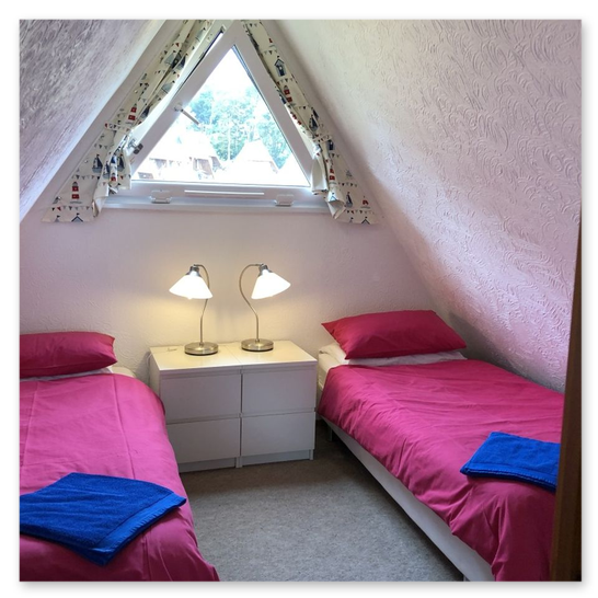 Two single beds with travel cot available
